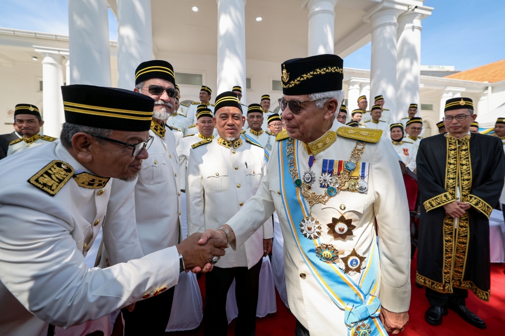 Yang di-Pertua Negeri Tun Ahmad Fuzi Abdul Razak shakes hands with state assemblymen after the opening ceremony of the First Meeting of the Second Session of the 15th State Legislative Assembly at the Penang State Legislative Assembly, May 27, 2024. Also present is Penang State Legislative Assembly Speaker Datuk Law Choo Kiang (right). — Bernama pic 