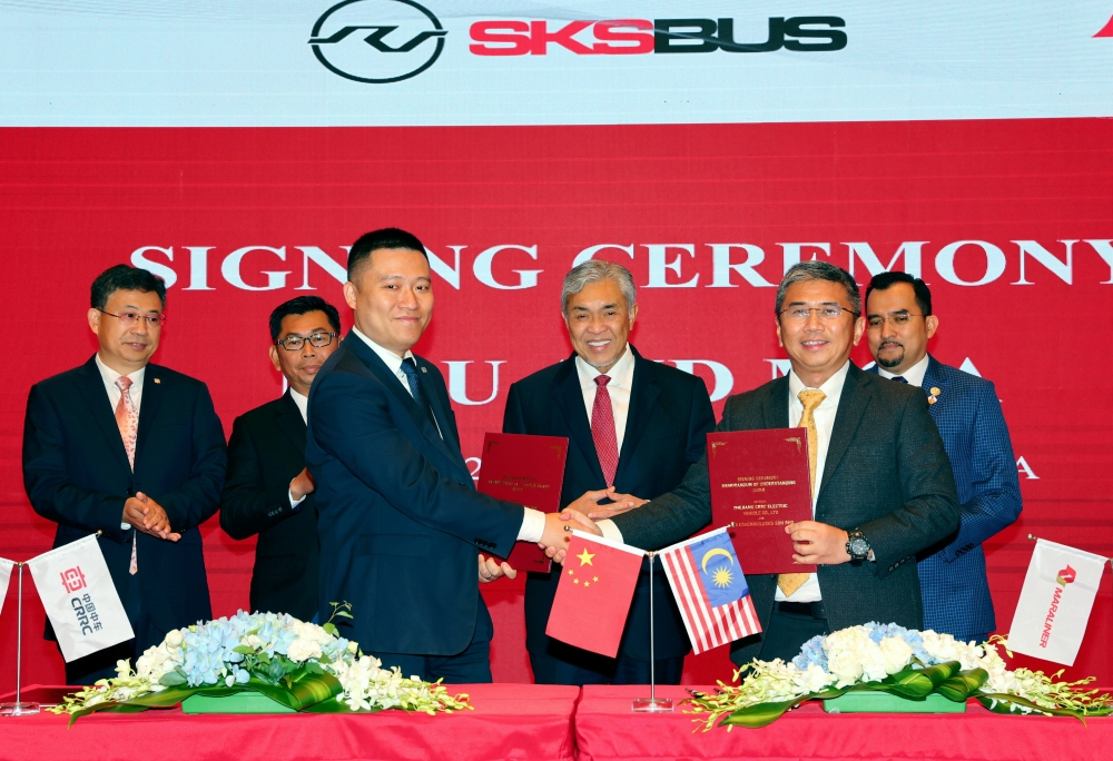 Deputy Prime Minister Datuk Seri Ahmad Zahid during a press conference after the signing of a MoU between SKS Coach Builders chief executive officer Datuk Roy Soo Kum Kin (2nd, right) and CRRC EV Group vice-president (3rd, left) in Shanghai, May 27, 2024. — Bernama pic 