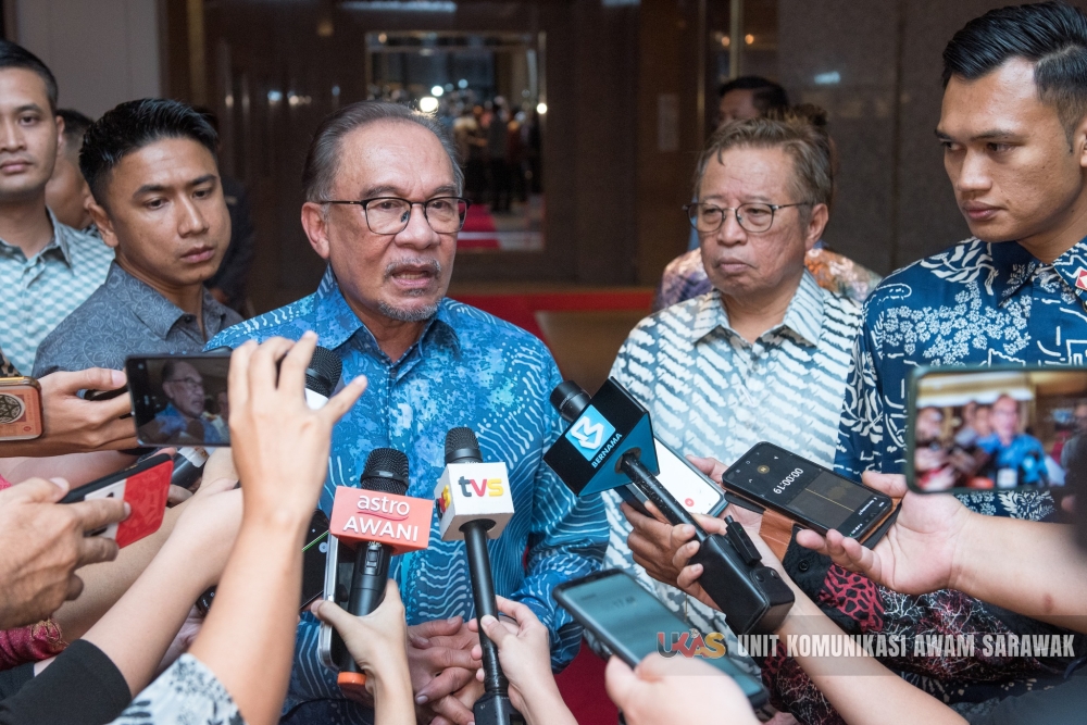 Prime Minister Datuk Seri Anwar Ibrahim talks to reporters after a meeting with Sarawak leaders in Kuching, May 27, 2024. — Picture courtesy of Sarawak Public Communications Unit