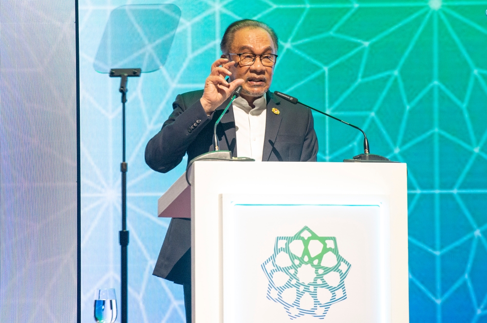 Prime Minister Datuk Seri Anwar  Ibrahim delivers his keynote address during the Global Forum on Islamic Economic and Finance at the KL Convention Centre in Kuala Lumpur May 28, 2024. — Picture by Shafwan Zaidon