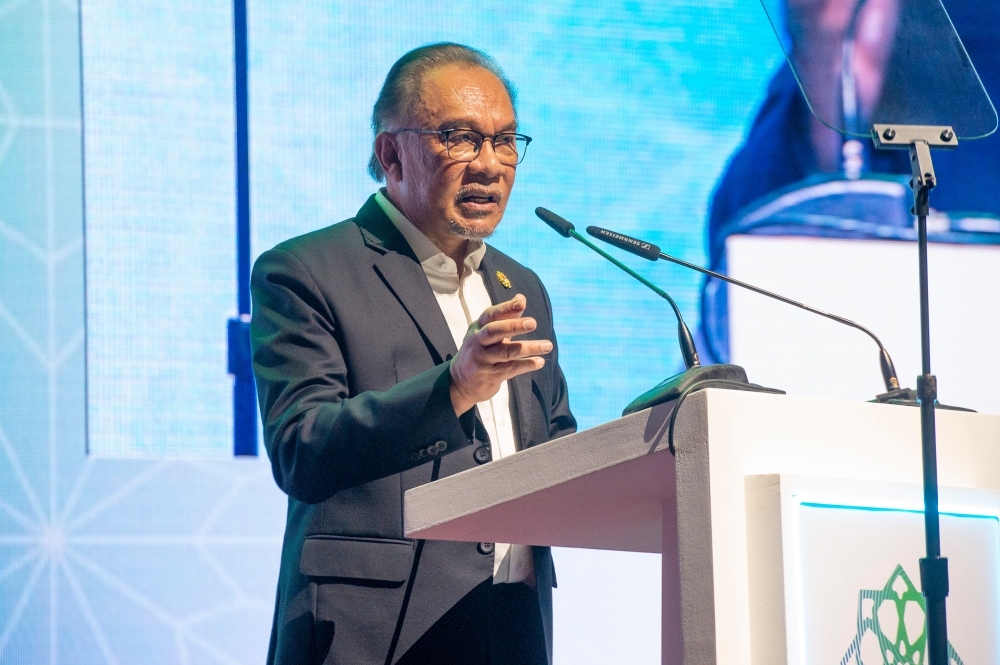 Prime Minister Datuk Seri Anwar Ibrahim delivers his keynote address during the Global Forum on Islamic Economics and Finance at the KL Convention Centre in Kuala Lumpur May 28, 2024. — Picture by Shafwan Zaidon