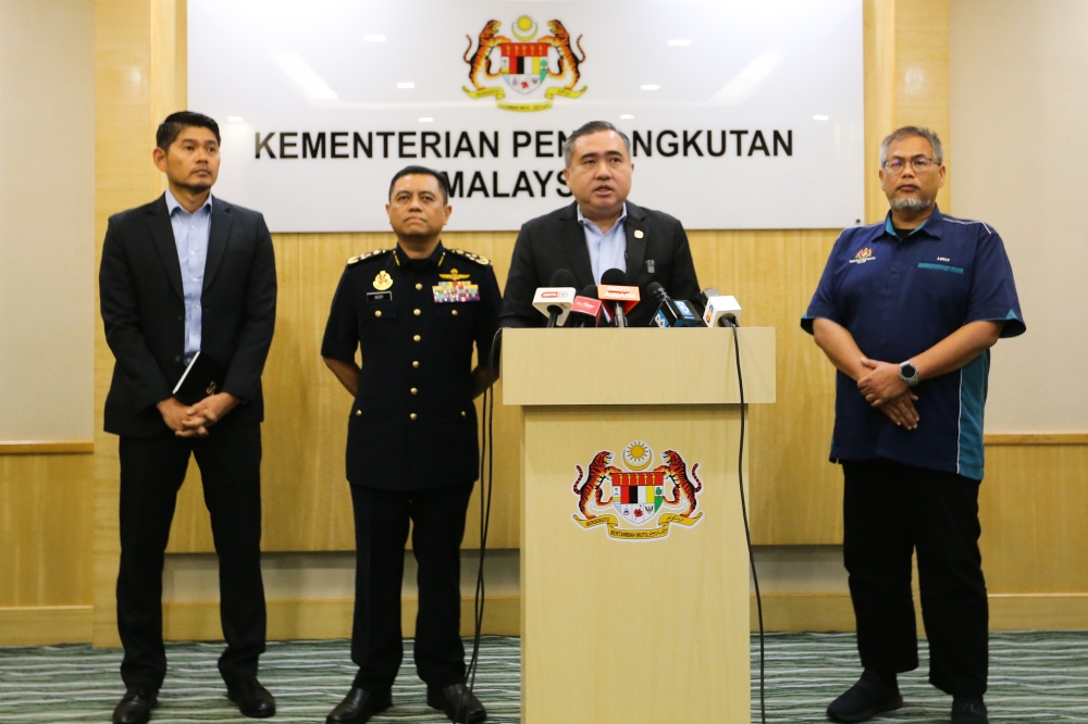 Transport Minister Anthony Loke Siew Fook (second from right) speaks during a press conference in Putrajaya May 28, 2024. — Picture by Miera Zulyana
