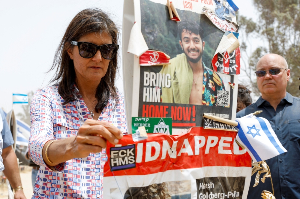 Former US presidential hopeful Nikki Haley has been photographed writing ‘Finish Them’ on an Israeli shell as she toured sites in southern Israel. — Reuters pic