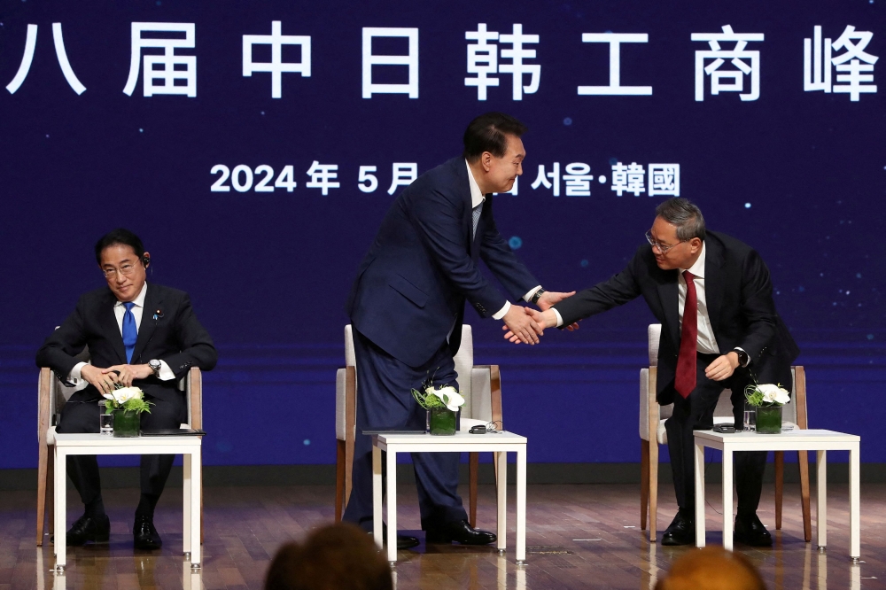 Japanese Prime Minister Fumio Kishida, South Korean President Yoon Suk Yeol and Chinese Premier Li Qiang attend the business summit at the Korea Chamber of Commerce and Industry on May 27, 2024 in Seoul, South Korea.  — Reuters pool pic