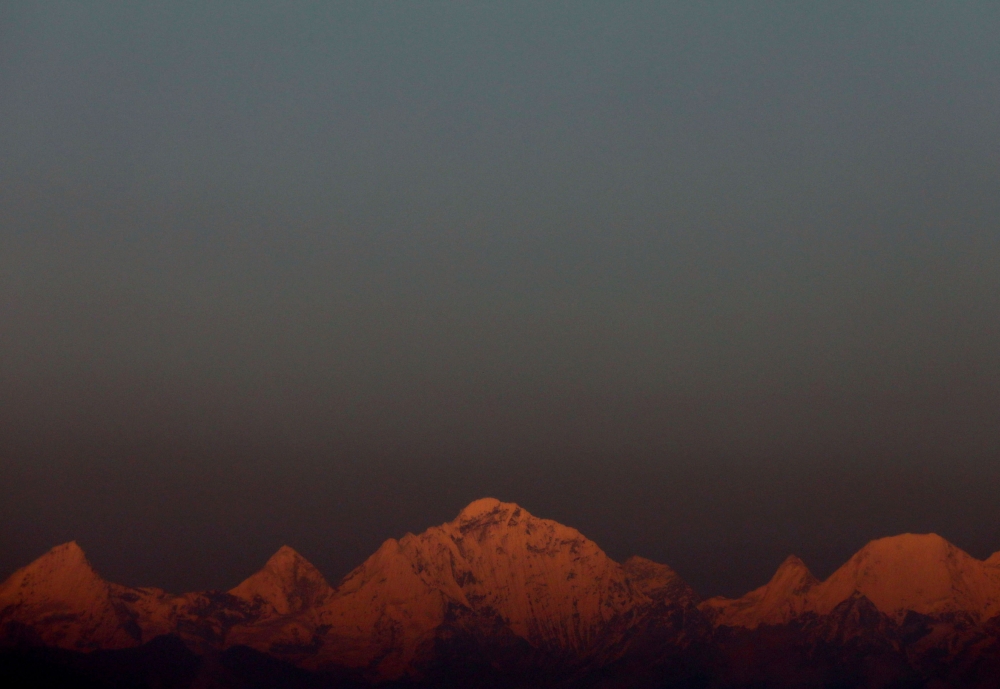 Mount Everest, the world's highest mountain, and other peaks of the Himalayan range are seen during sunset from Kathmandu, Nepal October 17, 2022. — Reuters pic