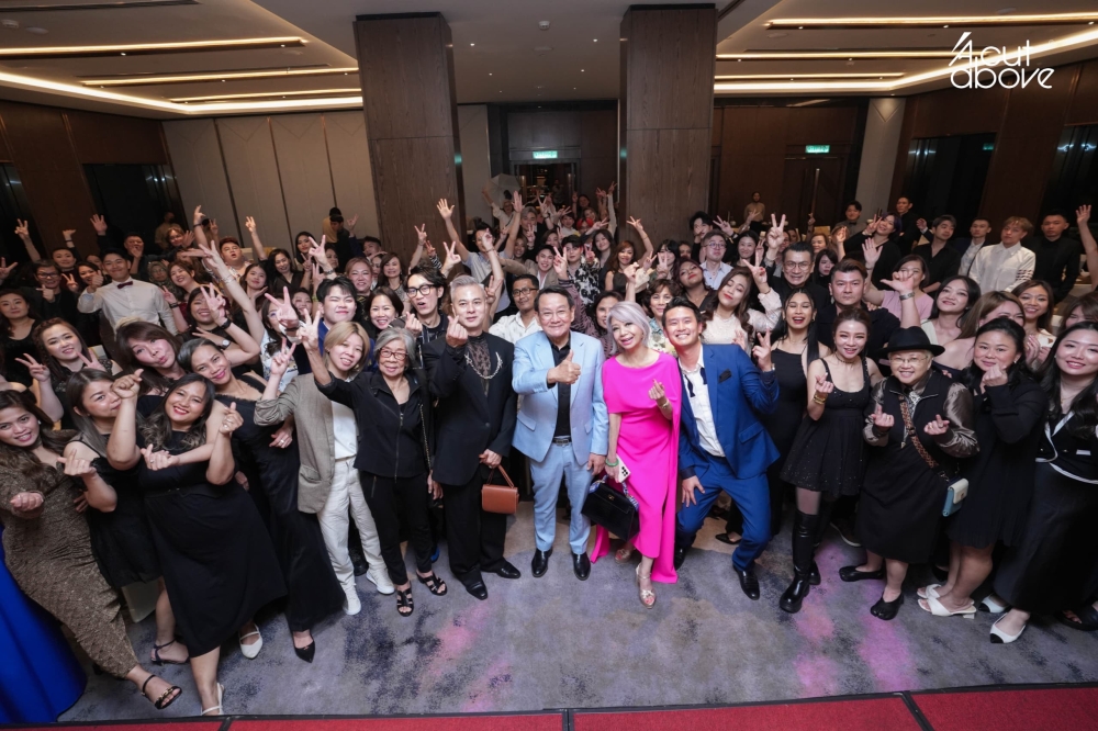 Loo with her staff at a recent dinner to celebrate the company’s 45th anniversary. — Picture courtesy of A Cut Above