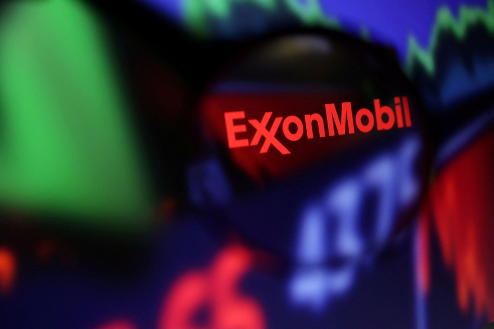 ExxonMobil shareholders overwhelmingly reelected the oil giant’s board Wednesday, the company said, endorsing its hardball tactics in confronting climate activist investors. — Reuters pic