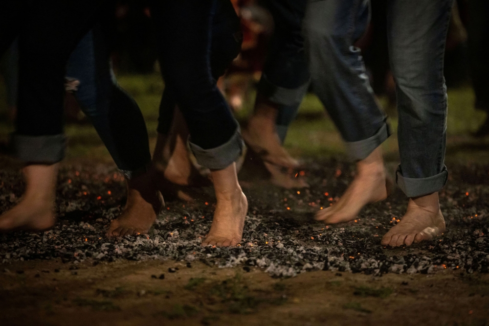 Devotees walk on burning coal on Saint Constantine and Saint Helen's Day, marking the beginning of the fire-walking ritual known as Anastenaria, in Mavrolefki, Greece May 21, 2024. — Reuters pic  