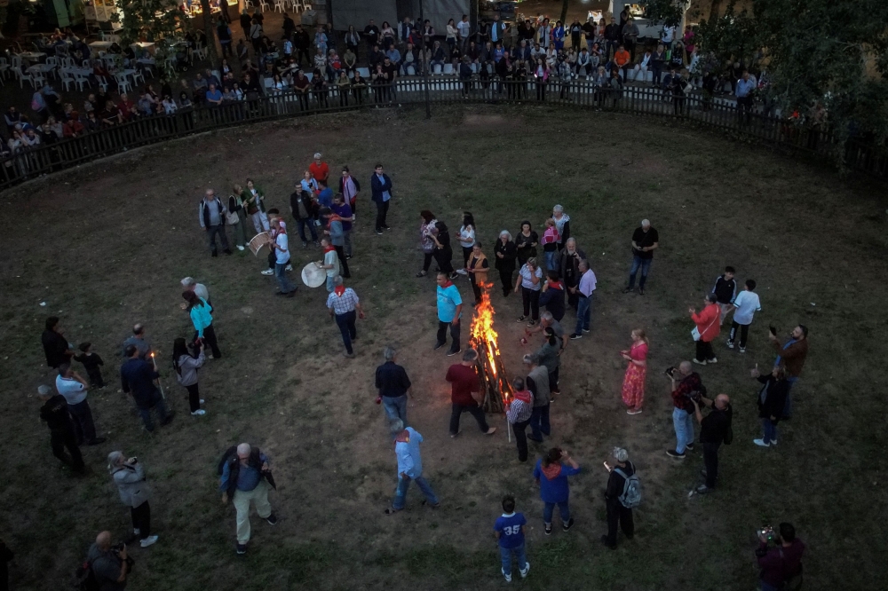 Devotees dance around a bonfire on Saint Constantine and Saint Helen's Day, which marks the beginning of the fire-walking ritual known as Anastenaria, in Mavrolefki, Greece May 21, 2024. — Reuters pic  