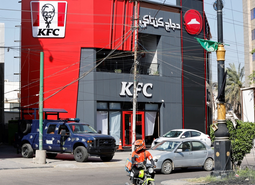 On Sunday, a makeshift bomb was thrown at a branch of the US fast-food chain KFC, causing minor damage. The next night, masked men broke into another branch, smashing glass. — Reuters pic
