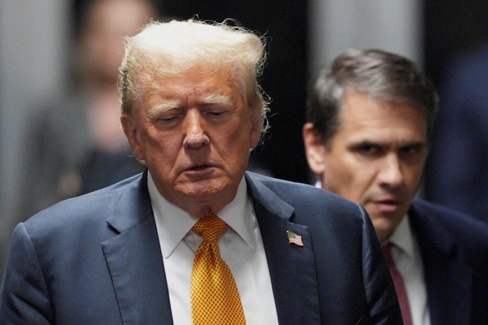 Former President Donald Trump speaks to press as the jury ends its first day of deliberations in the hush money trial filed against him by DA Bragg, in New York, May 29 2024. — Reuters pool pic 