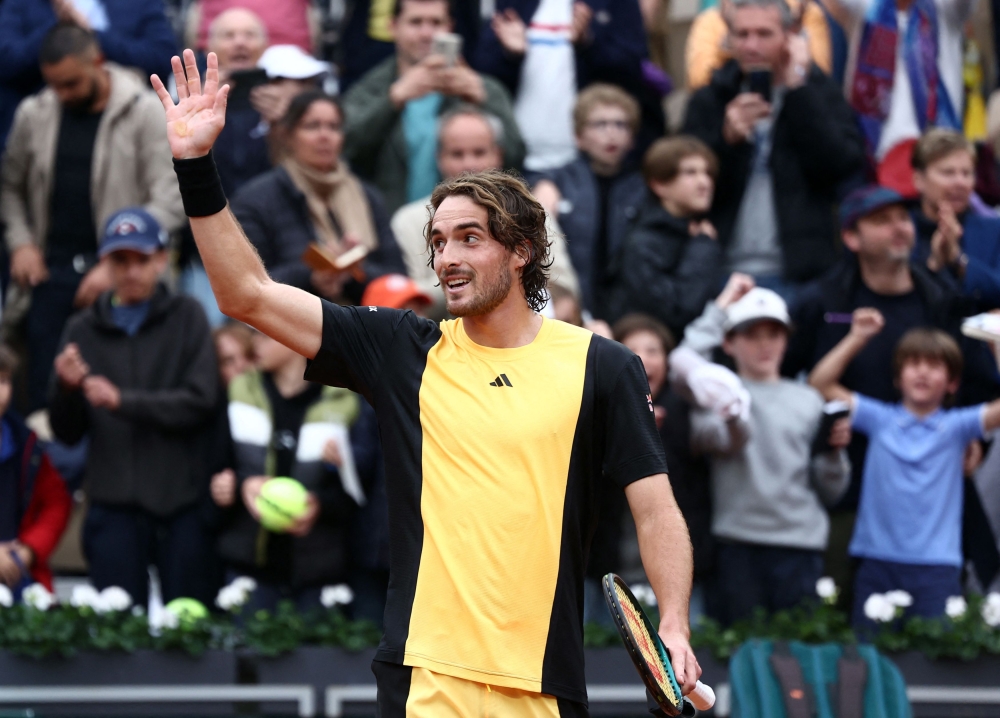 Greece's Stefanos Tsitsipas celebrates after winning his second round match against Germany's Daniel Altmaier in Paris May 29, 2024. ― Reuters pic