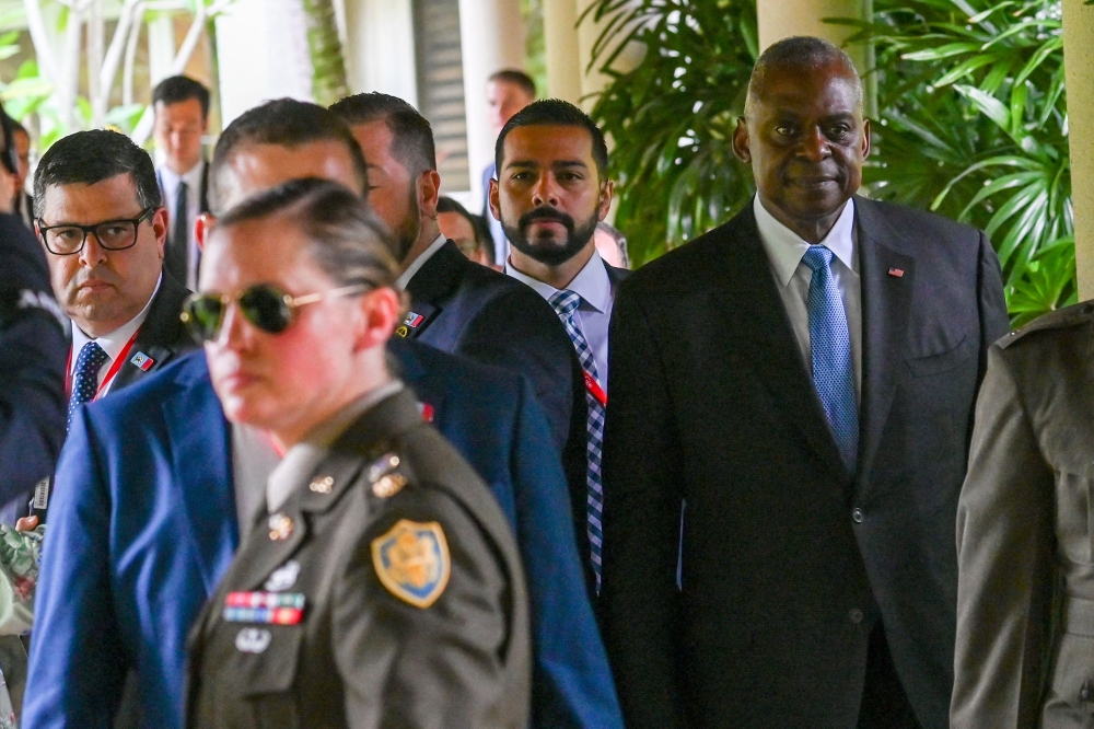 US Secretary of Defence Lloyd Austin (right) at the 21st Shangri-La Dialogue. — AFP pic