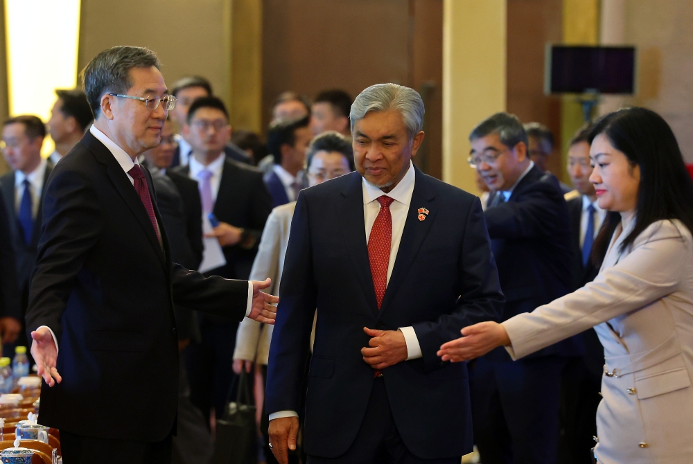  Deputy Prime Minister Datuk Seri Ahmad Zahid Hamidi (centre) and China Vice Premier Ding Xuexiang (left) during the celebration of the 50th anniversary of the establishment of diplomatic relations between Malaysia and China, in Beijing May 31, 2024. ― Bernama pic