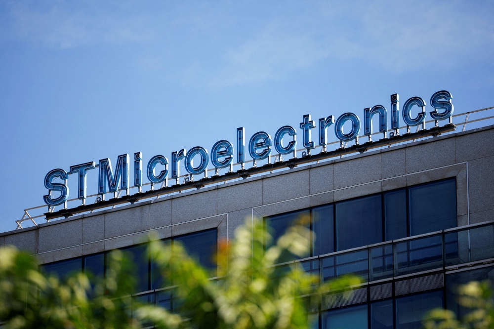 The logo of electronics and semiconductor manufacturer STMIcroelectronics is seen outside a company building in Montrouge, near Paris July 12, 2022. — Reuters pic  