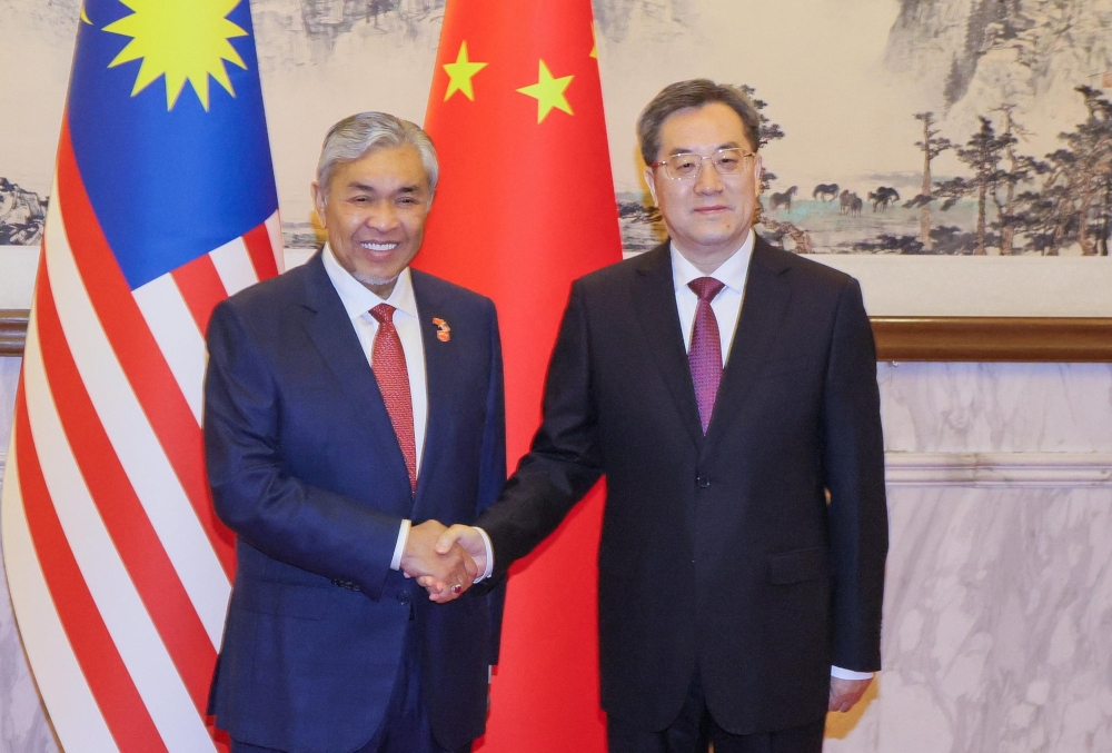 Deputy Prime Minister Datuk Seri Ahmad Zahid Hamidi with Chinese Deputy Prime Minister Ding Xuexiang at Villa 5, Diaoyutai National Guest House in Beijing, May 31, 2024. — Picture from X/Ahmad Zahid Hamidi 