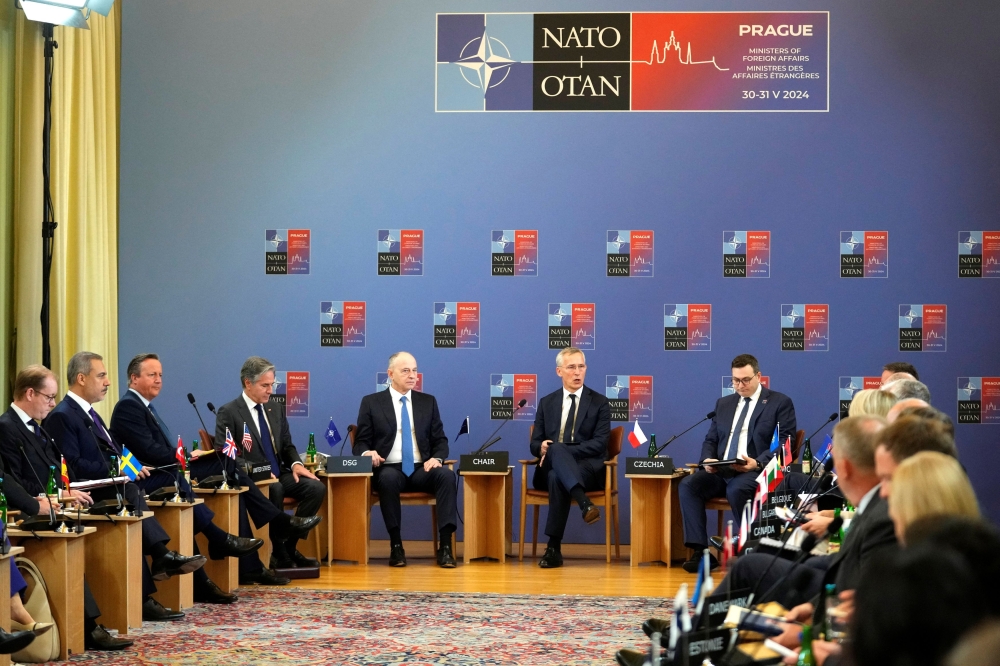 Nato Secretary General Jens Stoltenberg chairs a meeting of Nato foreign ministers, as Sweden’s Foreign Minister Tobias Billstrom, Turkey’s Foreign Minister Hakan Fidan, British Foreign Secretary David Cameron, United States Secretary of State Antony Blinken, Nato Deputy Secretary General Mircea Geoana, and Czech Republic’s Foreign Minister Jan Lipavsky attend, at the Czernin Palace, in Prague May 31, 2024. — Peter David Josek/Pool/Reuters pic