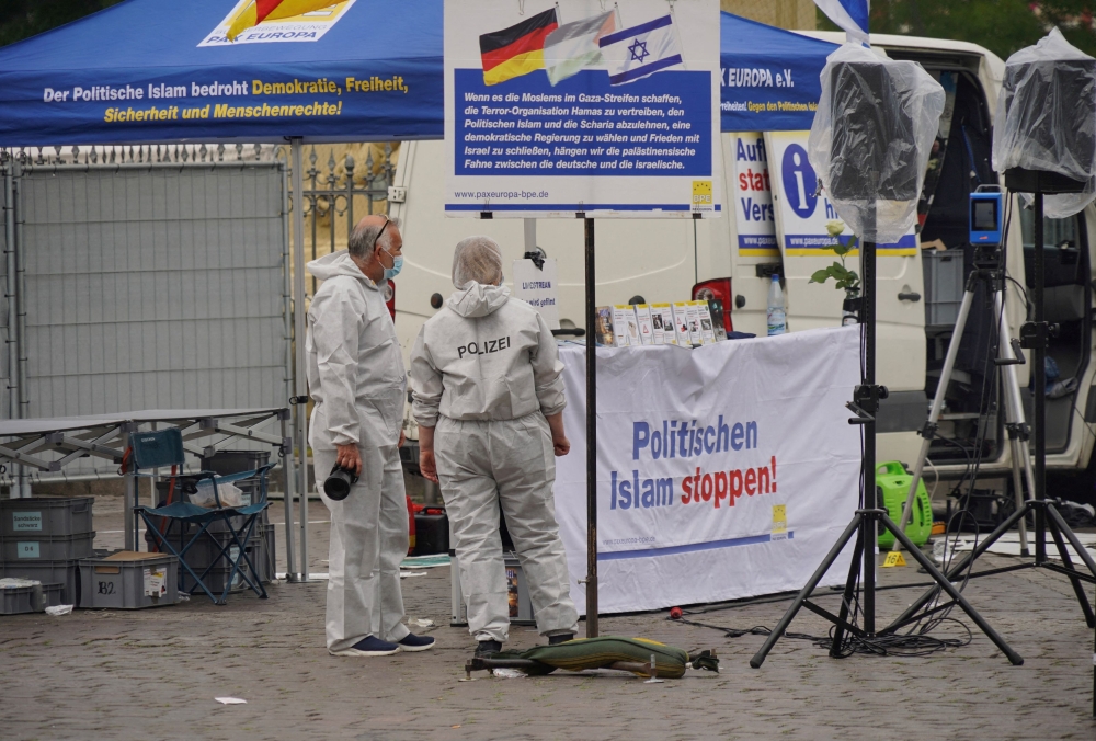 Police investigators work at the scene where a man attacked people at a far right-wing information stand of the Buergerbewegung Pax Europa (BPE) in the central market of the city of Mannheim May 31, 2024. — Reuters pic