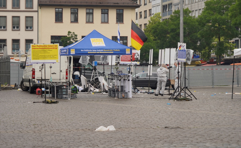 Police investigators work at the scene where a man attacked people at a far right-wing information stand of the Buergerbewegung Pax Europa (BPE) in the central market of the city of Mannheim, Germany, May 31, 2024. — Reuters pic