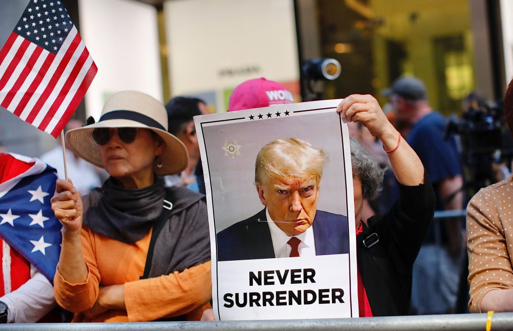 Trump Supporters gather outside Trump Tower before former US President and Republican presidential candidate Donald Trump holds a press conference after being found guilty over hush-money charges at Trump Tower in New York May 31, 2024. — AFP pic