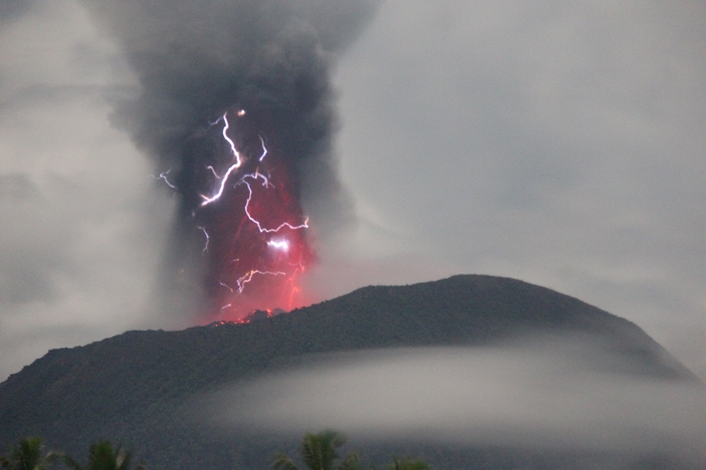 Lightning appears amid a storm as Mount Ibu spews volcanic material during an eruption, as seen from Gam Ici in West Halmahera, North Maluku province, Indonesia, May 18, 2024 in this handout image. — Handout by The Center for Volcanology and Geological Hazard Mitigation (PVMBG) via Reuters 