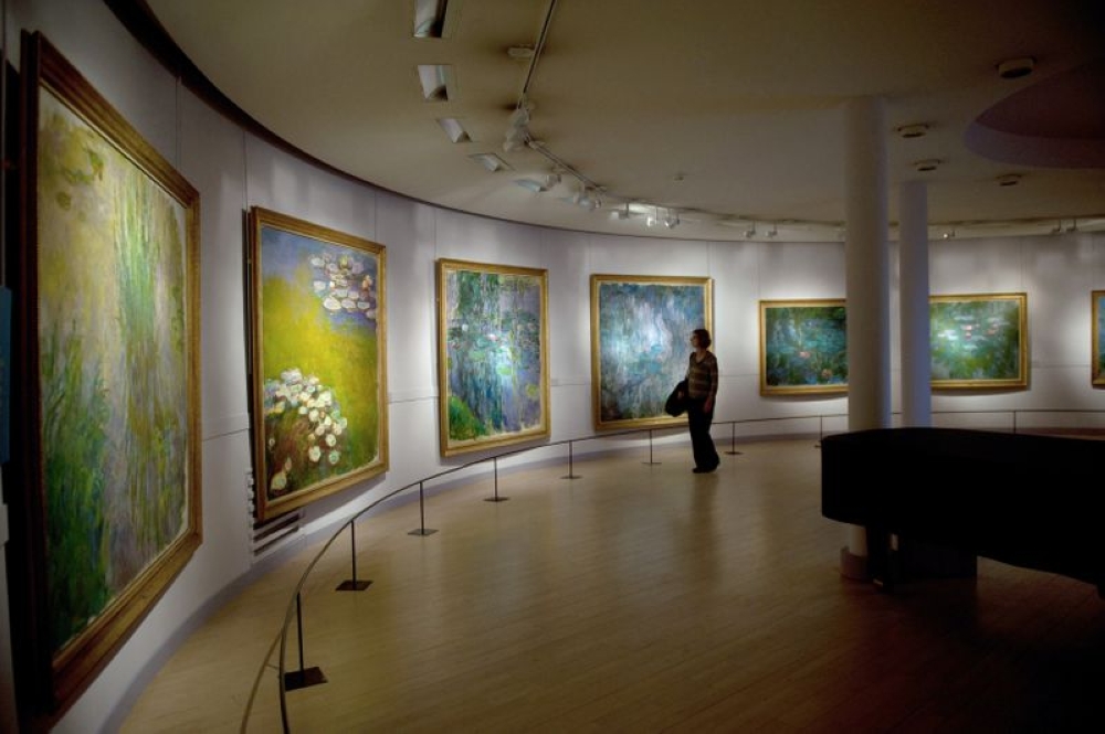 File photo of a visitor looking at Nympheas series by French artist Claude Monet at the Marmottan museum, October 2010. — AFP pic