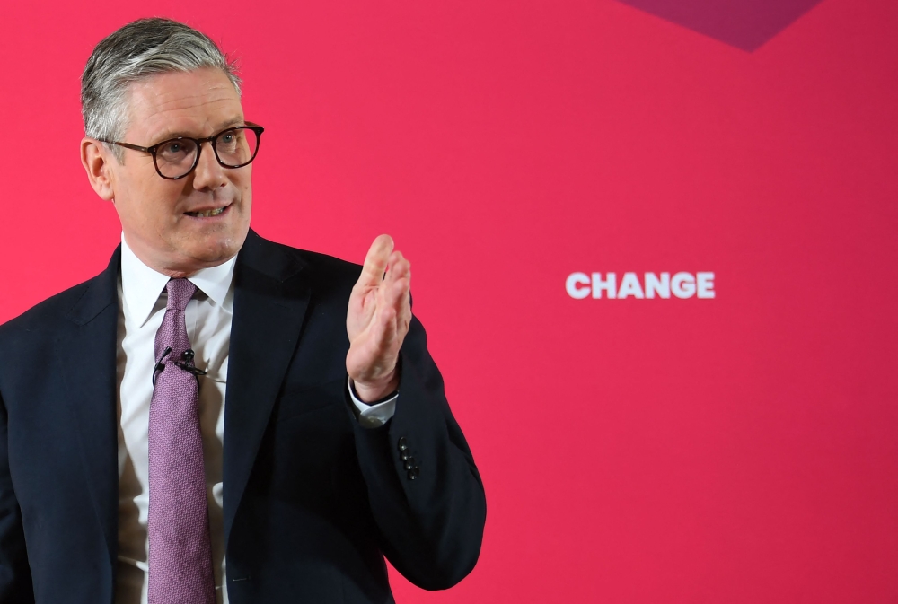 Opposition Labour party leader Keir Starmer pledged yesterday to cut the number of migrants entering Britain, in response to one of the key issues going into the country’s general election. — AFP pic