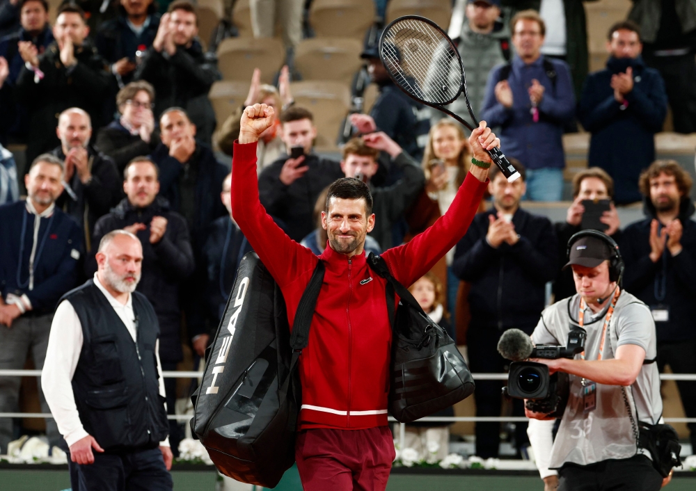 Defending champion and 24-time Grand Slam title winner Novak Djokovic came from two sets to one down to defeat Lorenzo Musetti 7-5, 6-7 (6/8), 2-6, 6-3, 6-0. — Reuters pic