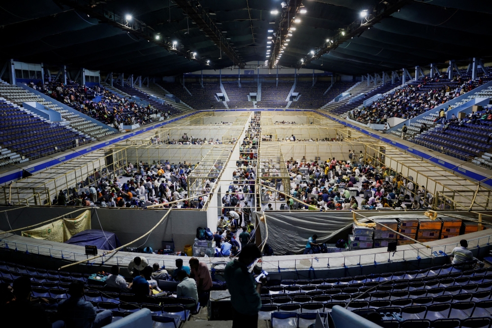 Polling officials checking election materials inside an indoor stadium during the seventh and last phase of India’s general election in Kolkata, India. — Reuters pic