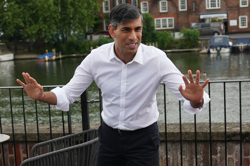 Britain's Prime Minister and Conservative Party leader Rishi has said the deportation flights will not leave before the July 4 election but has promised if he wins they would begin soon after. — Carl Court/Pool/AFP pic 