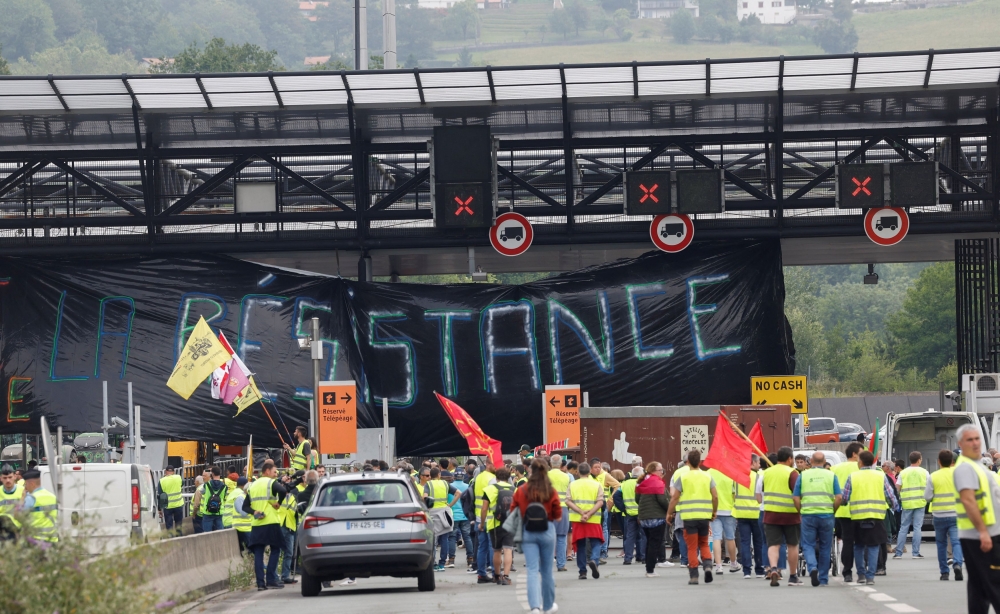 Farmers block the border between Spain and France, during a demonstration demanding better conditions ahead of European elections, Irun, Spain June 3, 2024. — Reuters pic  
