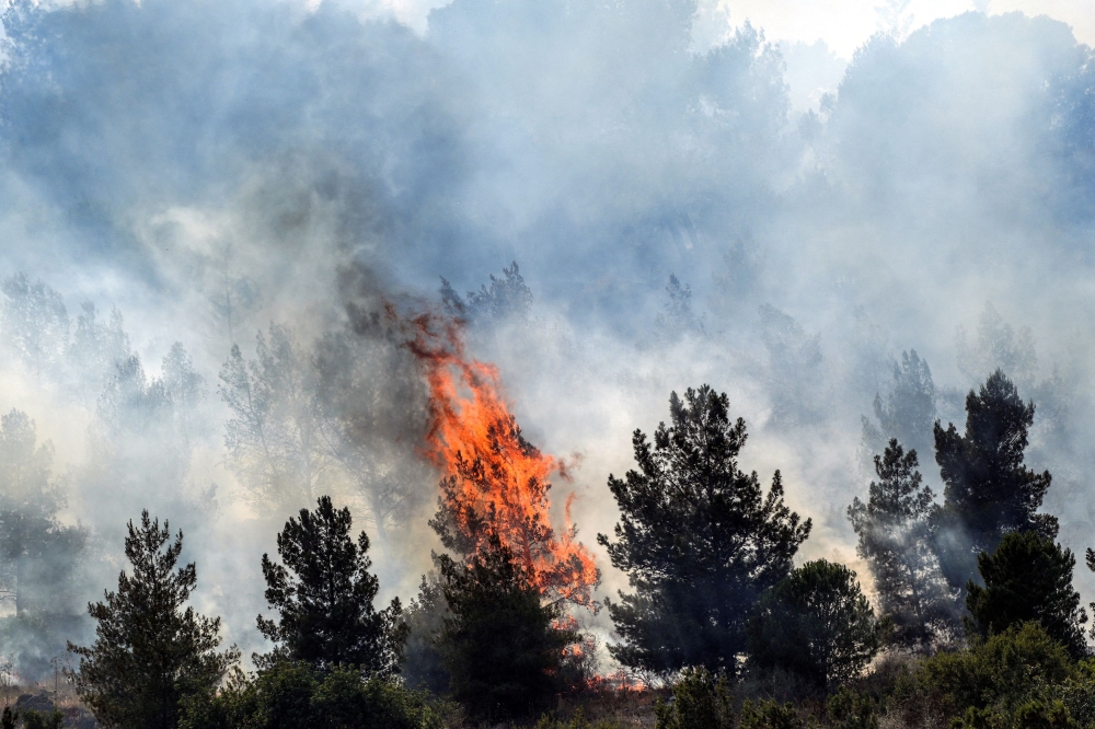 Smoke and fire rises following over border attacks from Lebanon, amid ongoing cross-border hostilities between Hezbollah and Israeli forces, close the Israeli border with Lebanon, seen from the Israeli side June 3, 2024. — Reuters pic