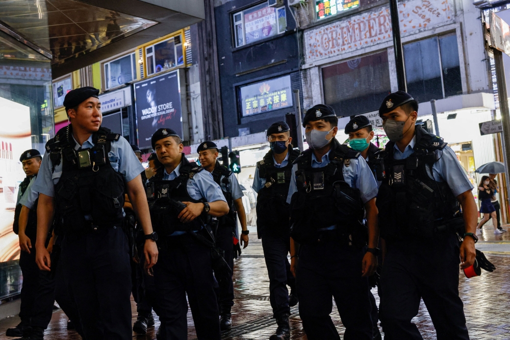 Police patrol at Causeway Bay, ahead of the 35th anniversary of the crackdown on pro-democracy demonstrators at Beijing's Tiananmen Square in 1989, near where the candlelight vigil is usually held, in Hong Kong, China, June 3, 2024. — Reuters pic