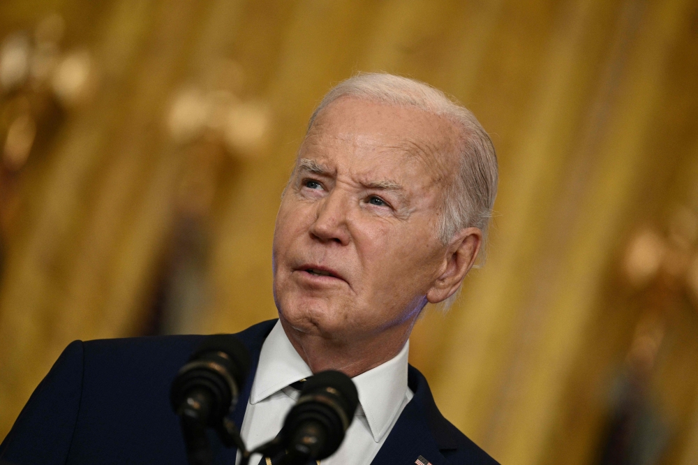 US President Joe Biden yesterday appeared to play down a suggestion he made in an interview with Time magazine that Israeli Prime Minister Benjamin Netanyahu was dragging out the Gaza war for political reasons. — AFP pic