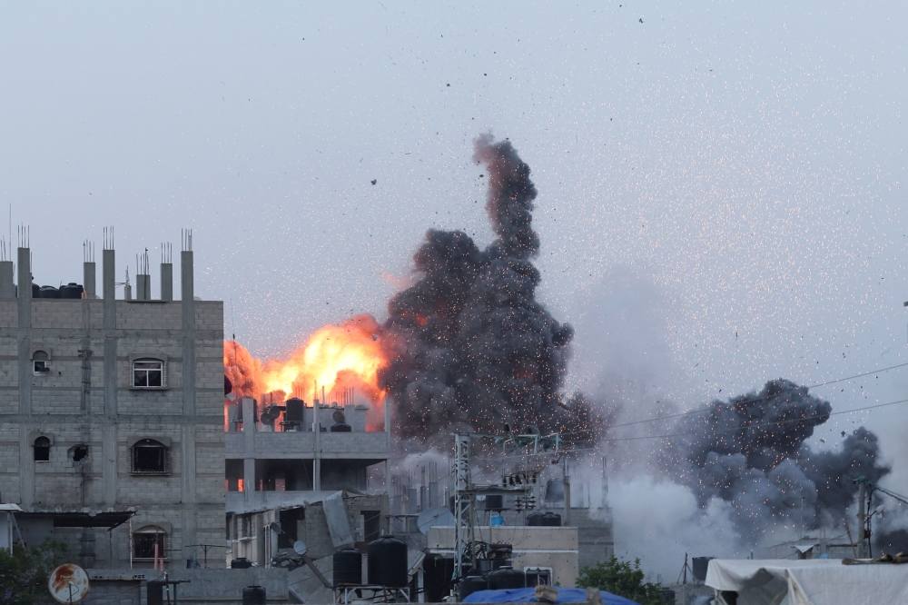 Israeli shelling and airstrikes killed at least 19 people in central and south Gaza on yesterday. — Reuters pic