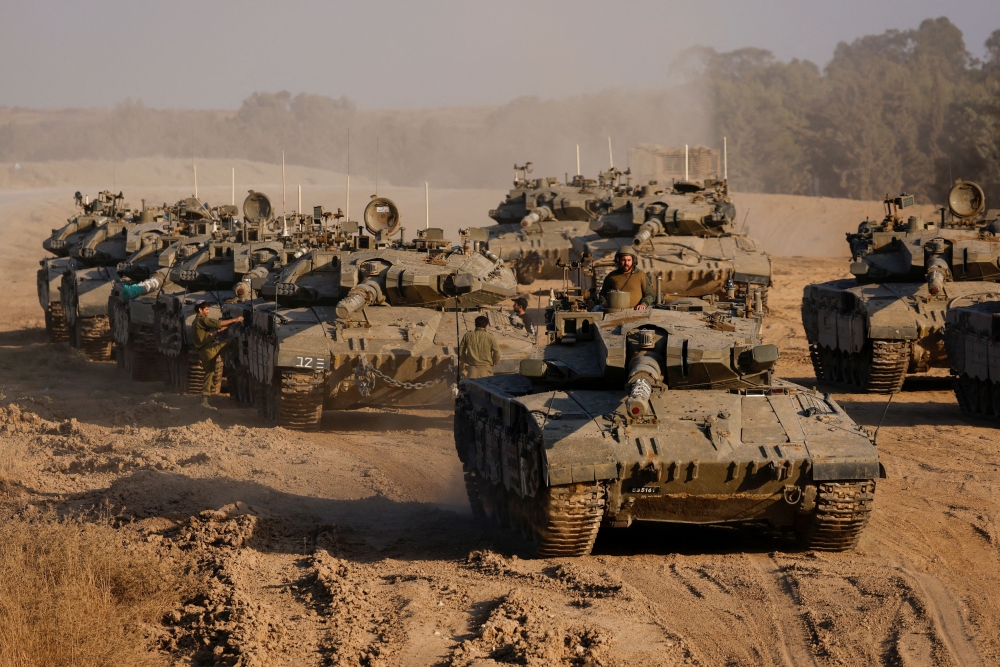 An Israeli soldier stands in a tank, amid the ongoing conflict between Israel and Hamas, near the Israel-Gaza border, in Israel, June 4, 2024. — Reuters pic