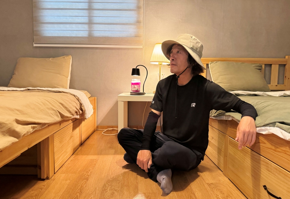 Yoon Seol-hyun, who runs a guesthouse near the demilitarised zone separating the two Koreas, rests before an interview with Reuters in Paju, South Korea, June 5, 2024. — Reuters pic