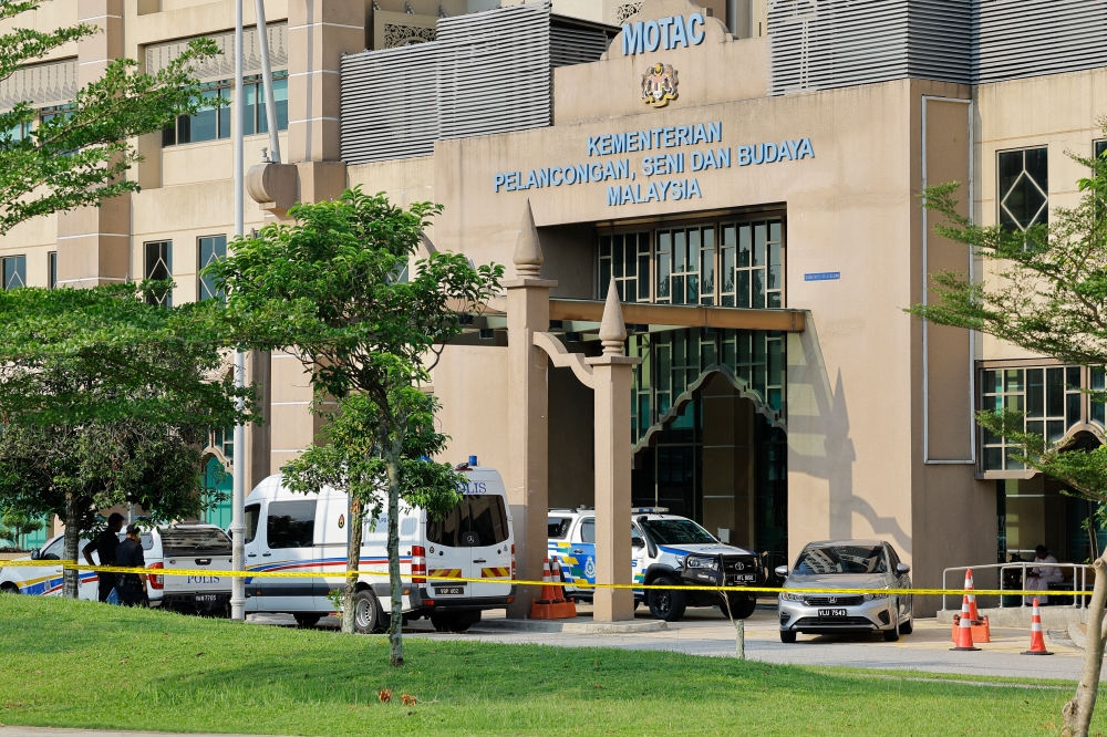 Police vehicles outside the Ministry of Tourism, Arts and Culture in Putrajaya, June 5, 2024. A suspicious package was sent to the Ministry of Tourism, Arts and Culture in Putrajaya today, forcing the evacuation of the premises. — Bernama pic    