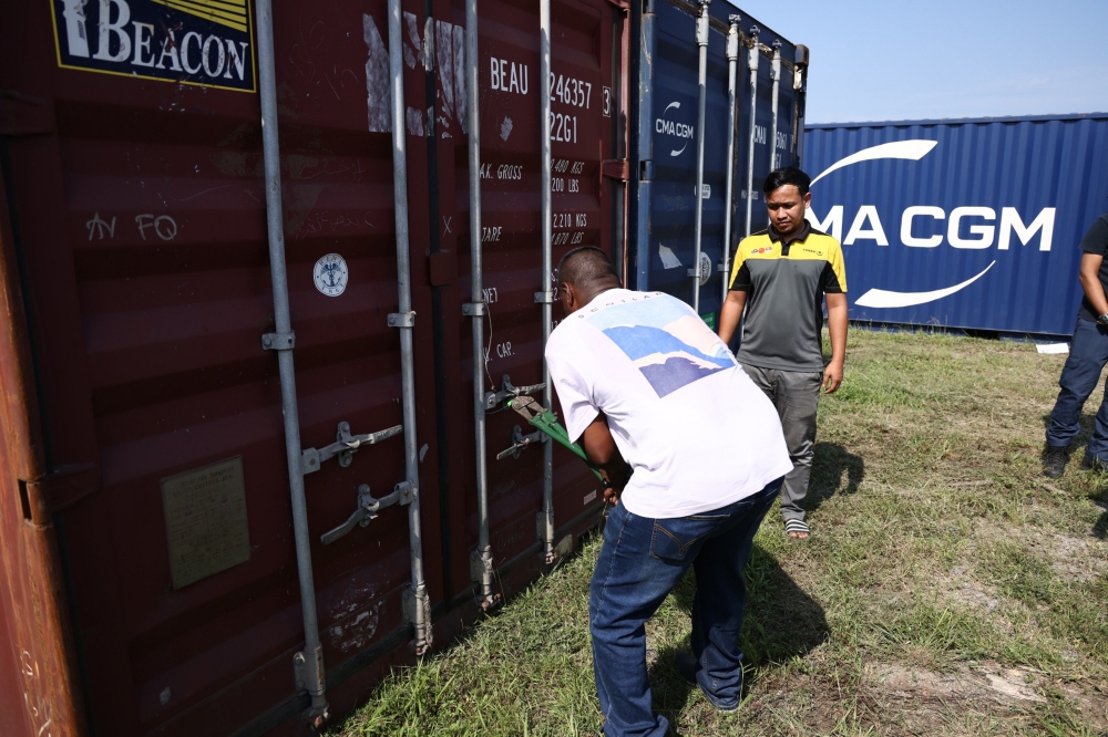 A total of 19 container lorries suspected of carrying various types of tax evasion goods that were smuggled out without going through inspection were arrested in a Transit Ops around Selangor and Kuala Lumpur recently. — Bernama pic 