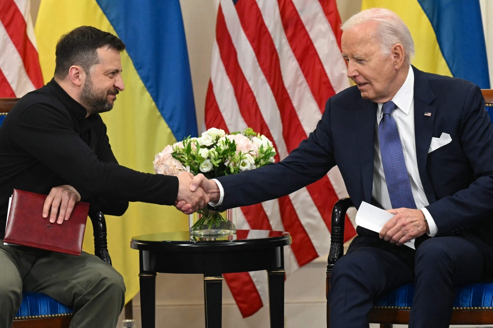 US President Joe Biden today pledged his support for Ukraine and announced another US$225 million in security aid to Kyiv as he met Ukrainian leader Volodymyr Zelensky for talks in Paris. — AFP pic