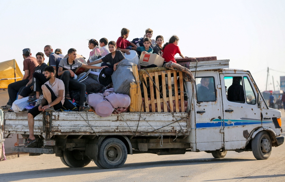 Palestinians flee Rafah due to an Israeli military operation, amid the Israel-Hamas conflict, in Rafah, in the southern Gaza Strip, June 7, 2024. ― Reuters pic