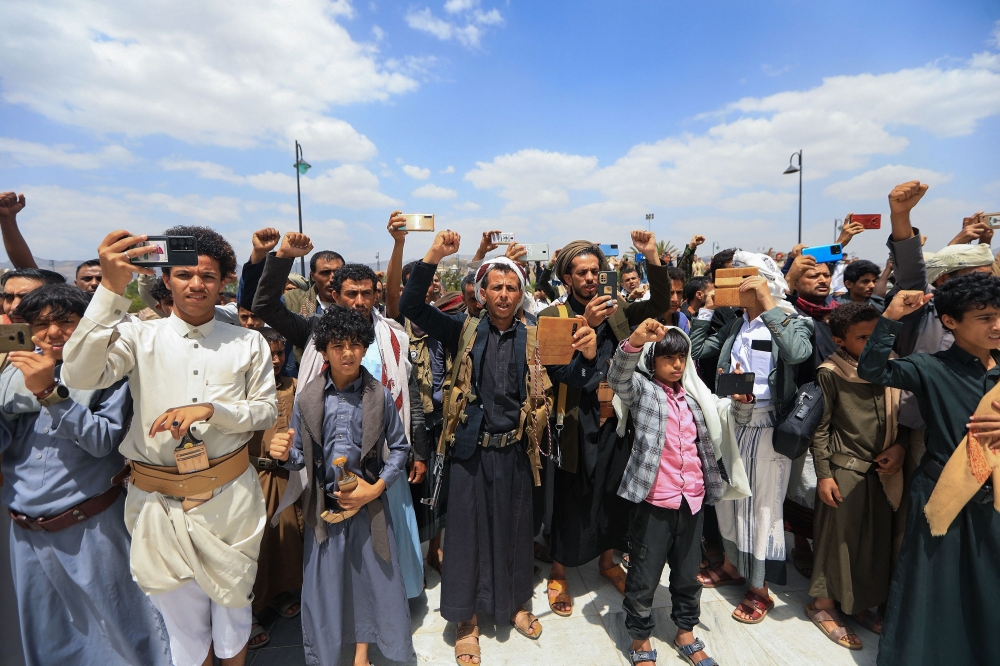 Yemenis chant slogans during a funeral ceremony for casualties of recent strikes by US and British forces, at Al-Saleh mosque in the Houthi-run capital Sanaa, on June 3, 2024. ― AFP pic
