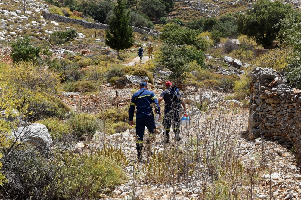Fire Department personnel inspect an area, following the search for missing British TV doctor Michael Mosley on the island of Symi, Greece June 7, 2024. ― Reuters pic