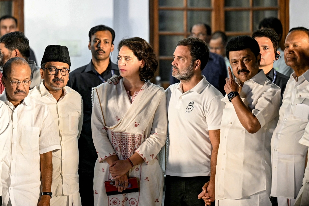 File photo of leaders of Indian National Congress (INC) party Rahul Gandhi (fourth right) and his sister Priyanka Gandhi Vadra (centre) alongwith MK Stalin (third right), Chief Minister of India’s Tamil Nadu state and President of Dravida Munnetra Kazhagam (DMK) party listen to an address by INC party President Mallikarjun Kharge (not pictured), after a meeting of opposition alliance Indian National Developmental Inclusive Alliance (INDIA) bloc in New Delhi on June 5, 2024, on the following day of voting results for India’s general election. ― AFP pic