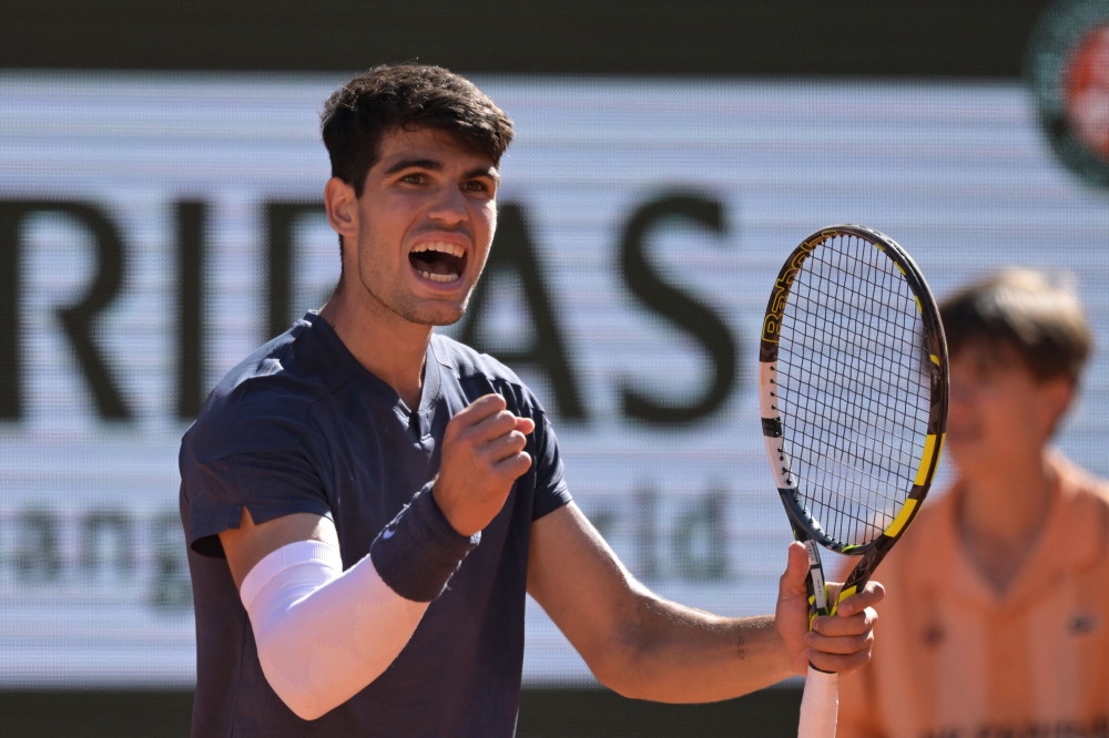 File photo of Spain’s Carlos Alcaraz reacting after a point during his men's singles semi-final match against Italy's Jannik Sinner on Court Philippe-Chatrier on day thirteen of the French Open tennis tournament at the Roland Garros Complex in Paris on June 7, 2024. ― AFP pic