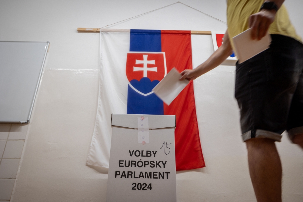 A voter casts his ballot at a polling station in Pezinok, Slovakia, during European Parliament Elections on June 8, 2024. ― AFP pic