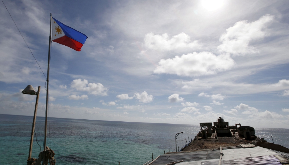 File photo of a Philippine flag fluttering on BRP Sierra Madre, a dilapidated Philippine Navy ship that has been aground since 1999, on the disputed Second Thomas Shoal, part of the Spratly Islands, in the South China Sea March 29, 2014. ― Reuters pic