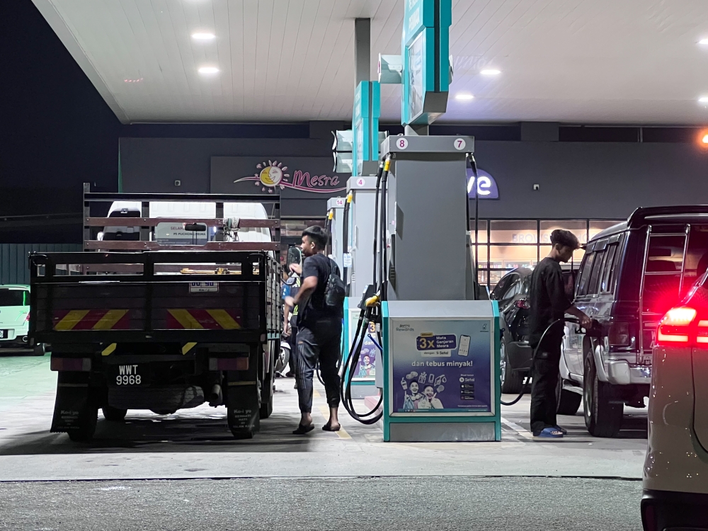 People refuel their diesel vehicles at a petrol station in Puchong June 9,2024. — Picture by Miera Zulyana