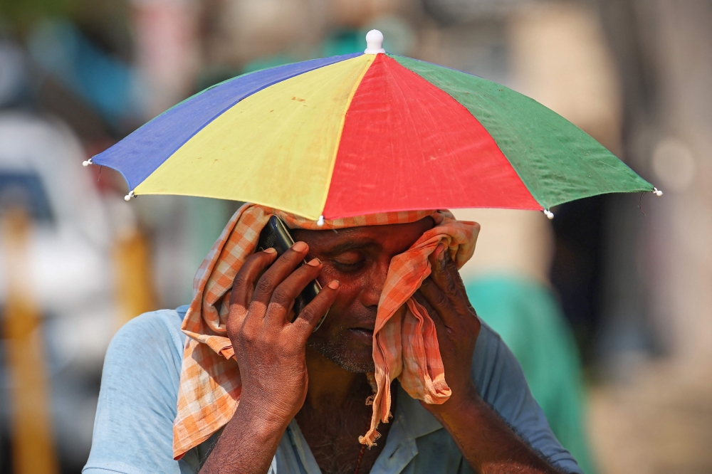 India’s heatwave is the longest ever to hit the country, the government’s top weather expert said today as he warned people will face increasingly oppressive temperatures. — AFP pic