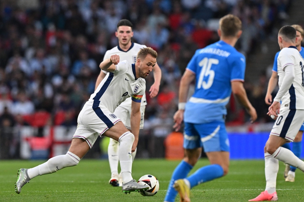 England’s striker Harry Kane runs with the ball during the International friendly football match between England and Iceland at Wembley Stadium in London on June 7, 2024. — AFP pic 